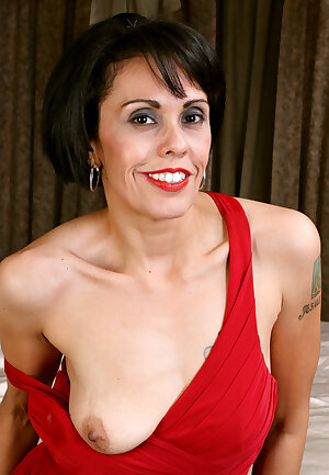 Sultry mature Gypsy Vixen in red dress